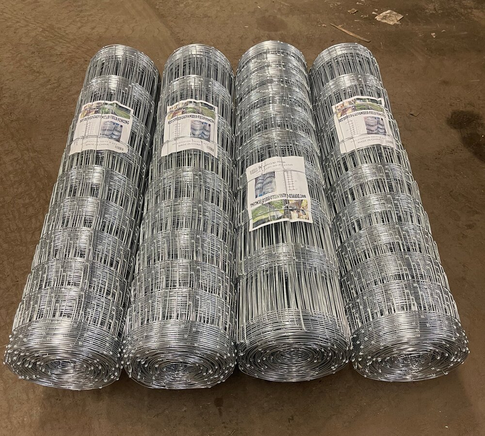Galvanized field fence rolls for calculating fencing cost per mile and acre